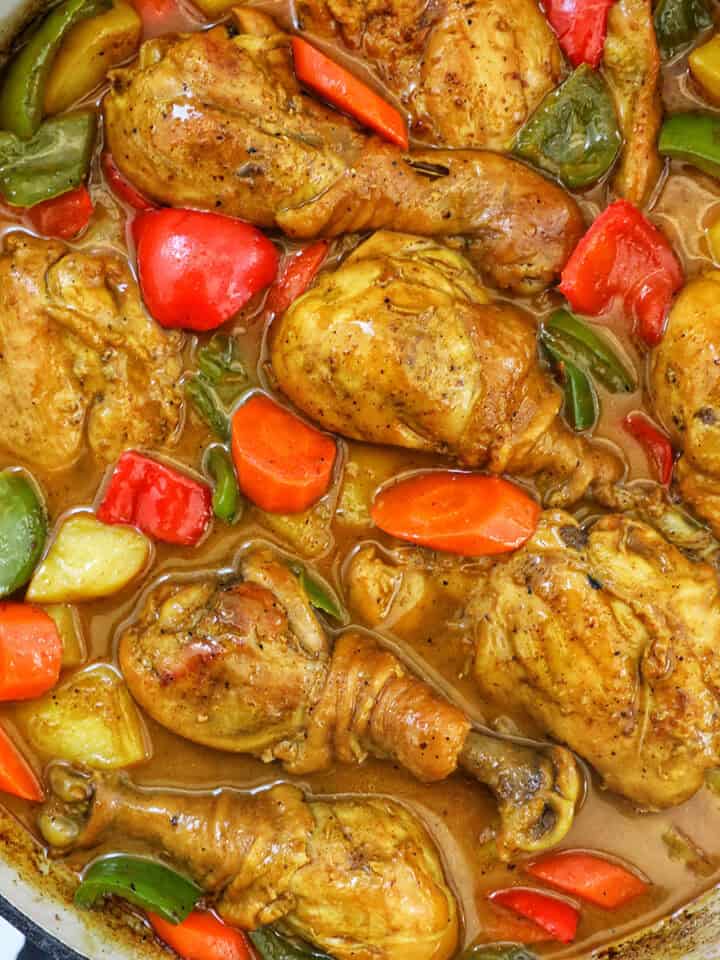 Filipino Chicken Curry with vegetables in a large pan.