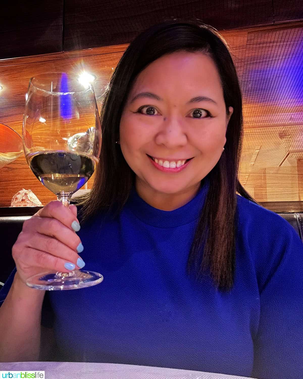 Marlynn Jayme Schotland with a glass of wine at Marea restaurant New York City (NYC)