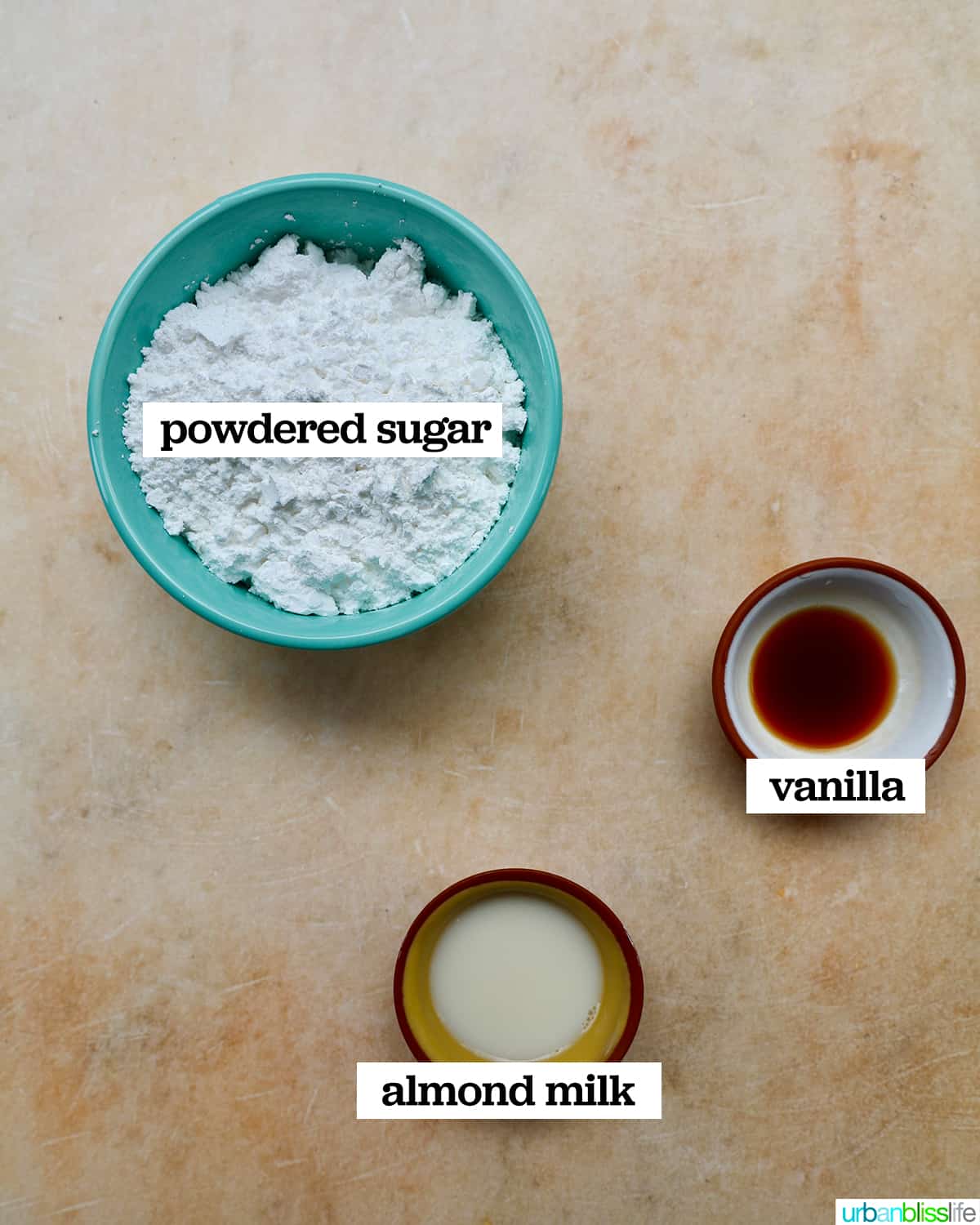 bowls of ingredients to make vanilla glaze.