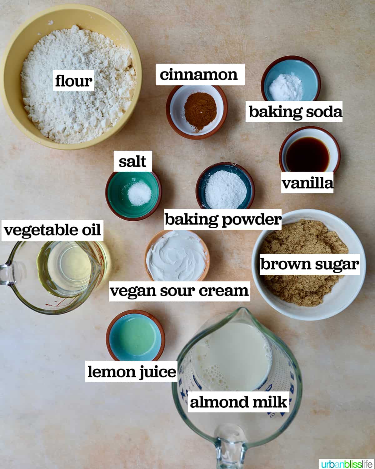 bowls of ingredients to make vegan cinnamon streusel muffins.