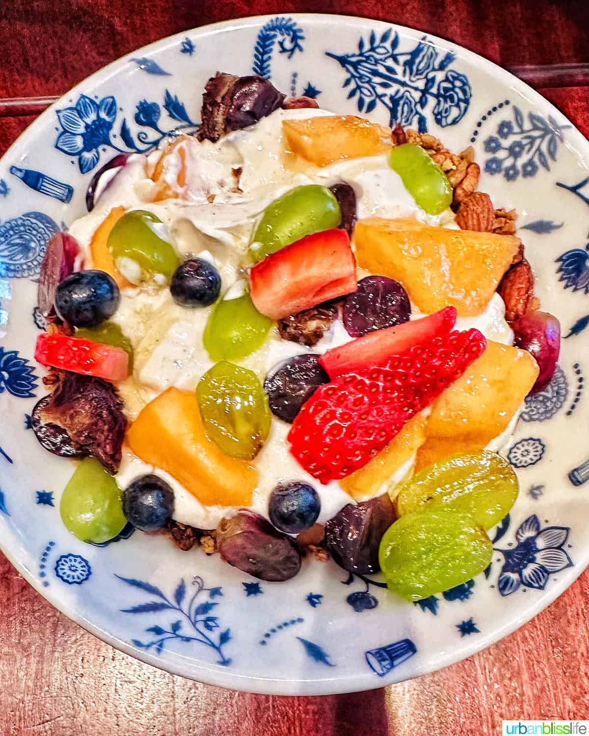 yogurt and fruit in a colorful bowl.