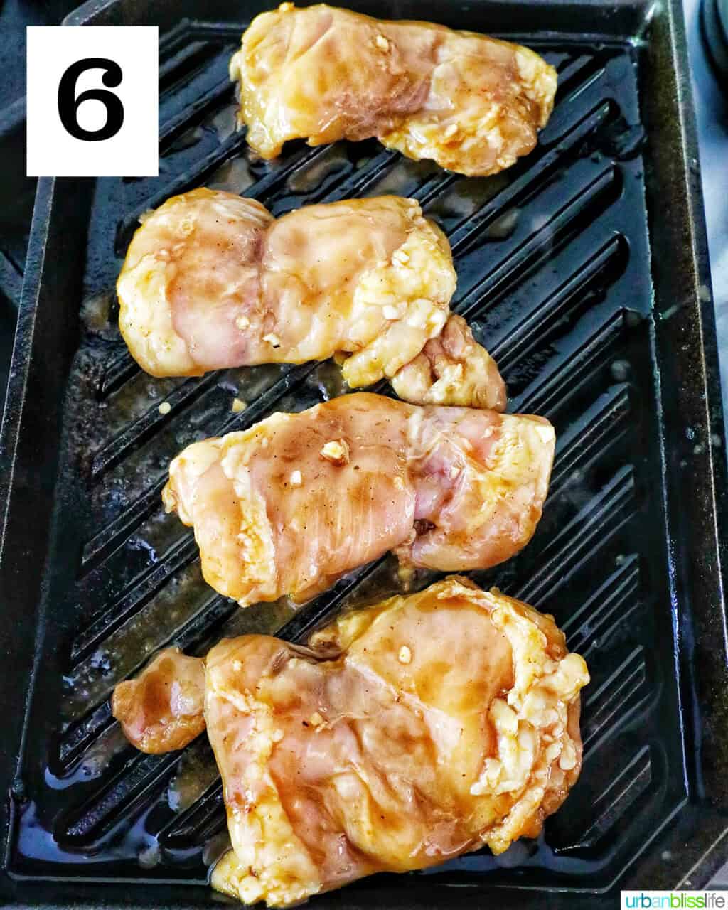 chicken thighs on a grill.