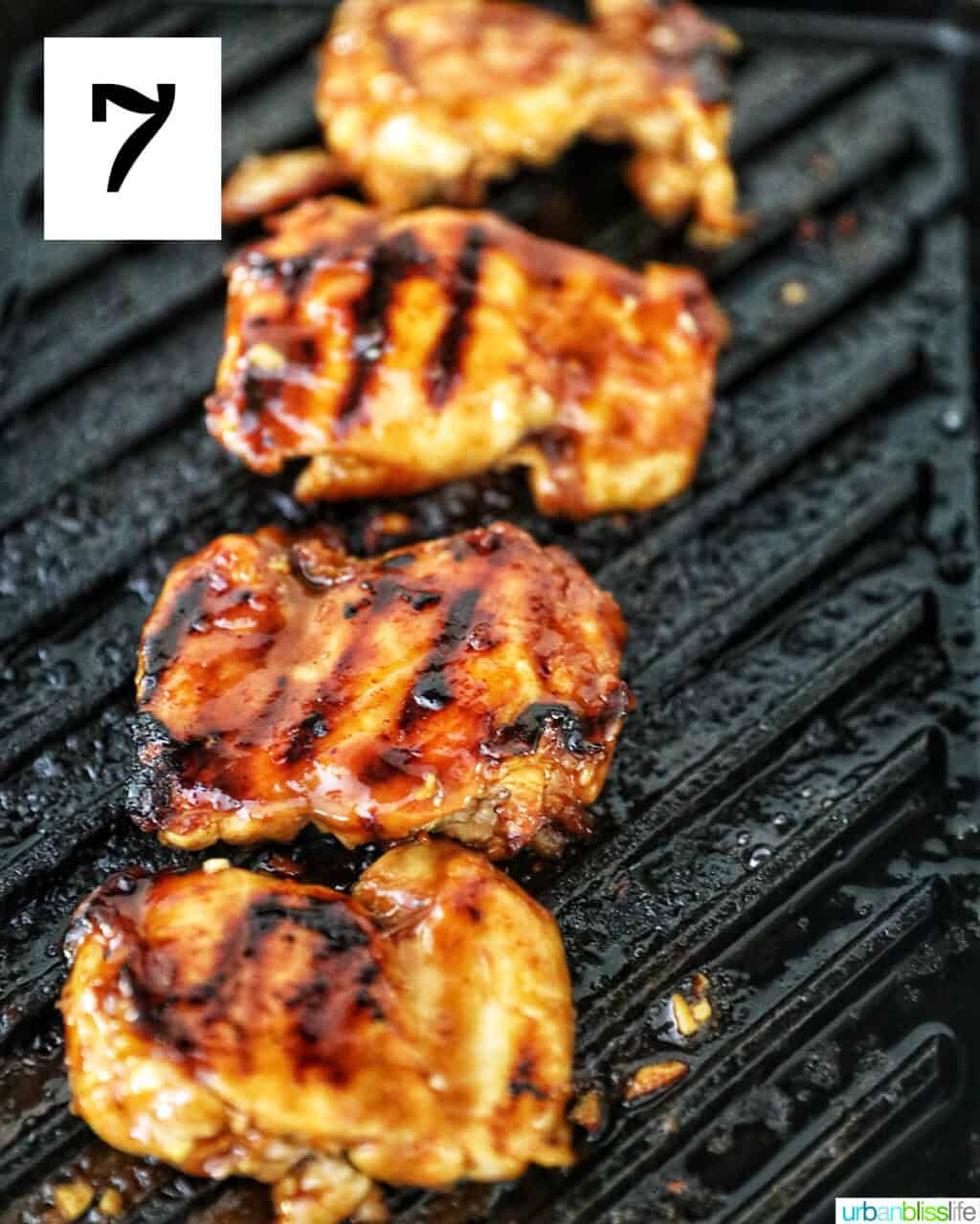 chicken thighs on a grill.