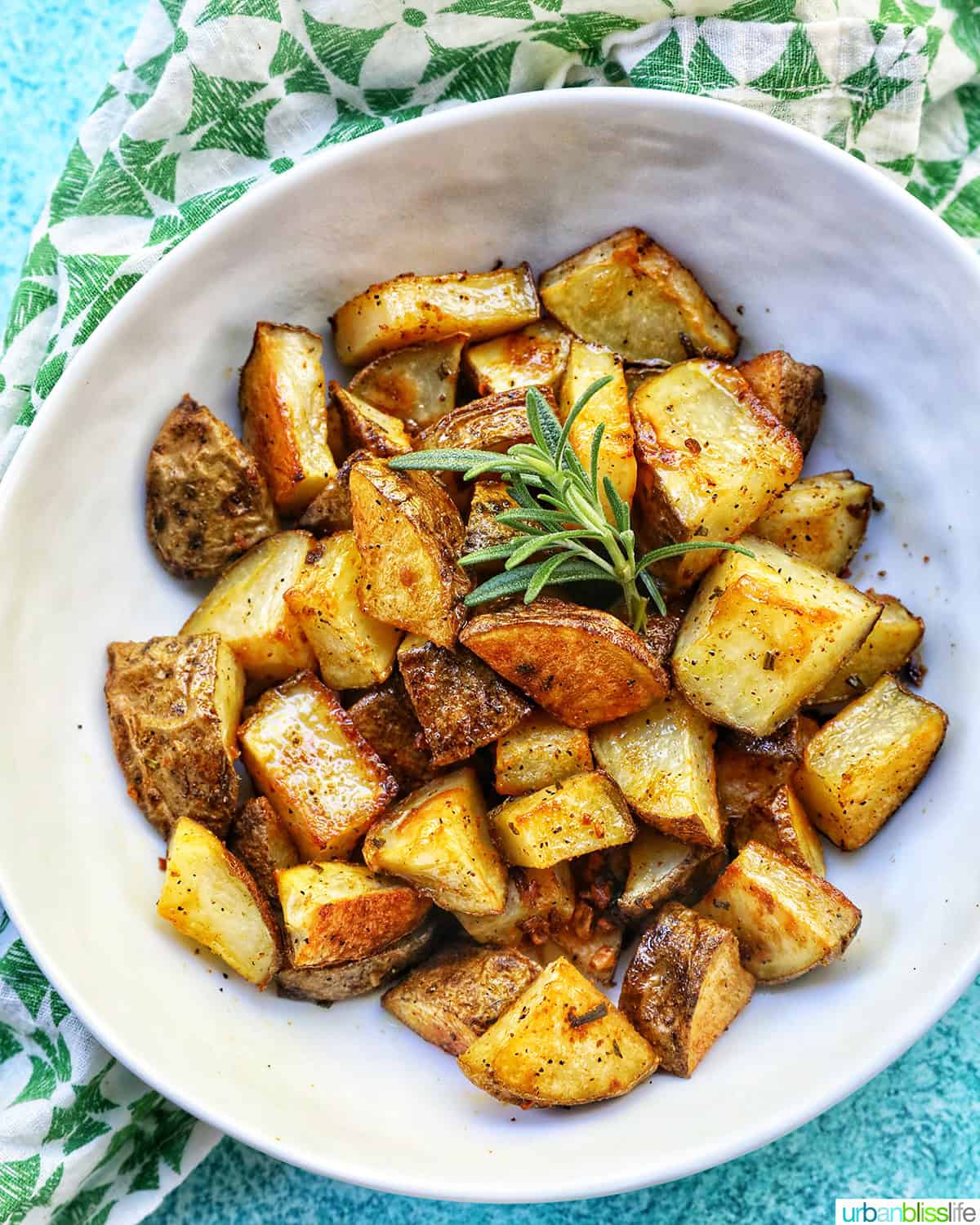 bowl of rosemary and garlic roasted potatoes.