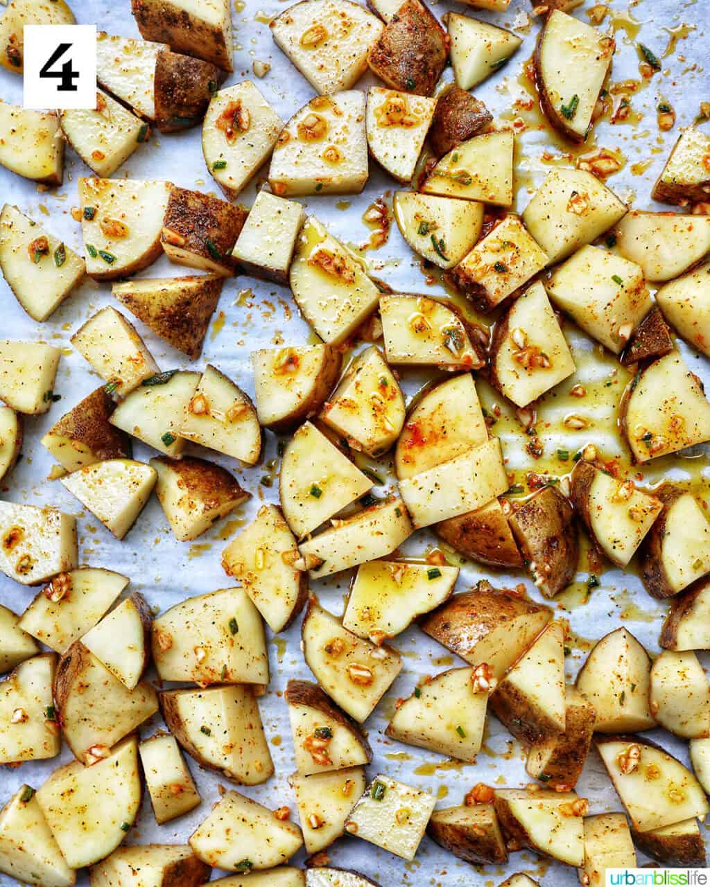 rosemary and garlic roasted potatoes on a baking sheet.