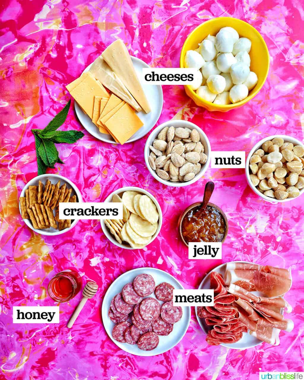 bowls of ingredients to make a summer charcuterie board.