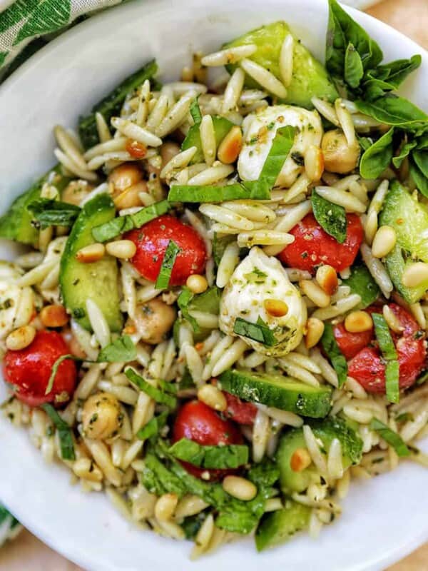 large bowl of orzo pesto pasta salad.
