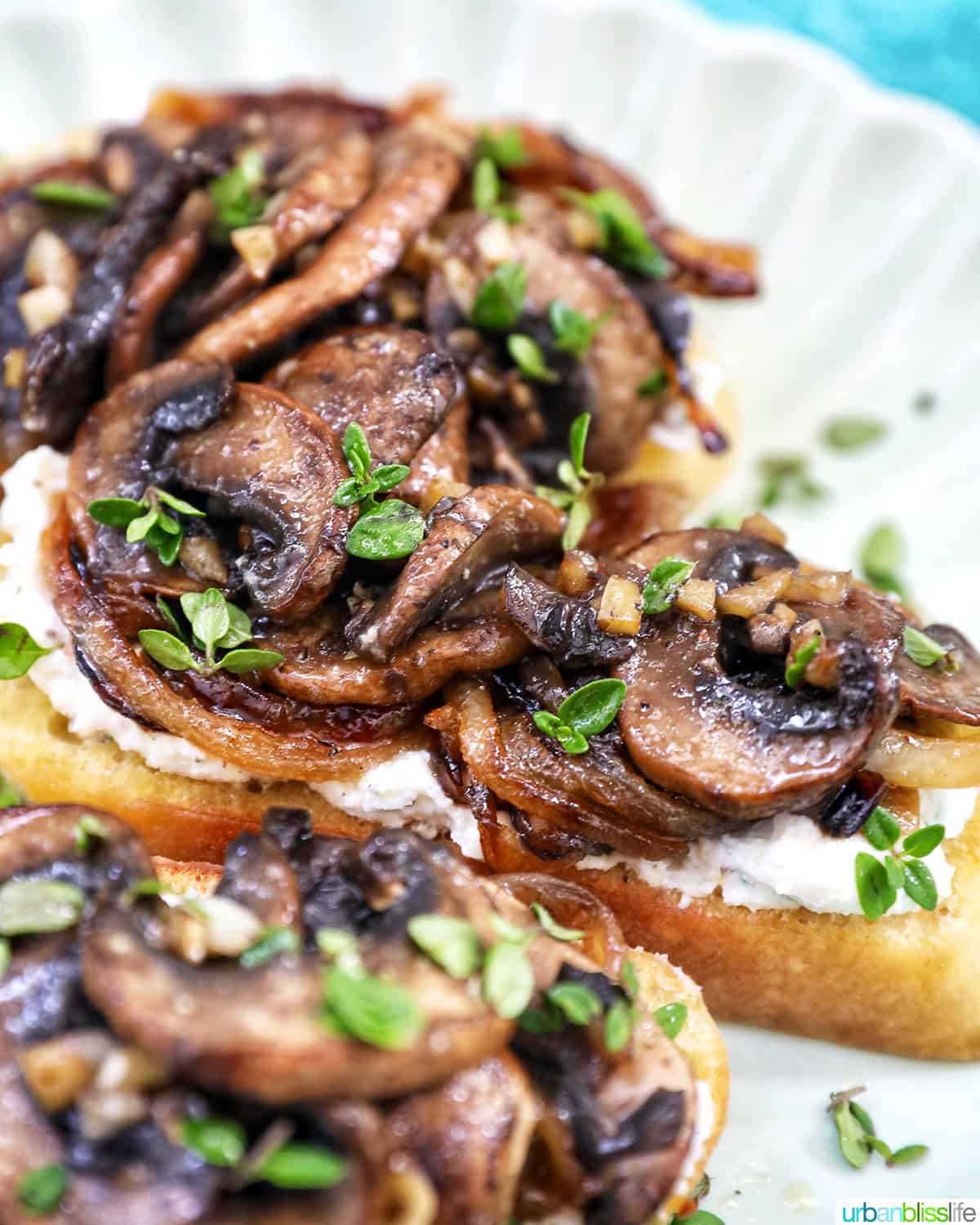 stack of mushroom crostini on a plate.