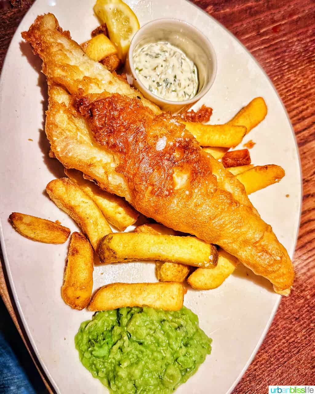 plate of fish and chips and mushy peas at Gordon Ramsay's Heddon Street Kitchen in London.