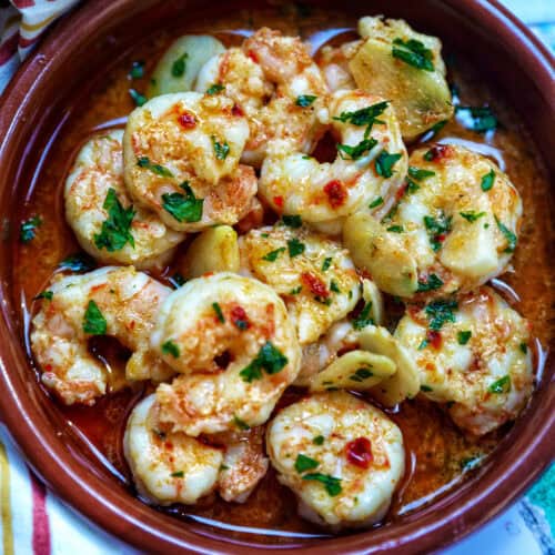 Spanish prawns with garlic (gambas al ajillo) in Spanish cazuelas clay dishes.