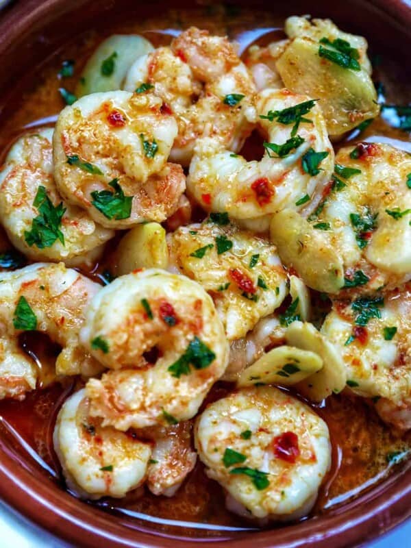Spanish prawns with garlic (gambas al ajillo) in Spanish cazuelas clay dishes.