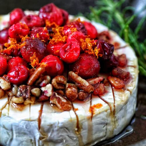 cranberry pecan baked brie in a skillet.