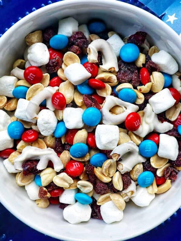 red white and blue trail mix in a bowl.