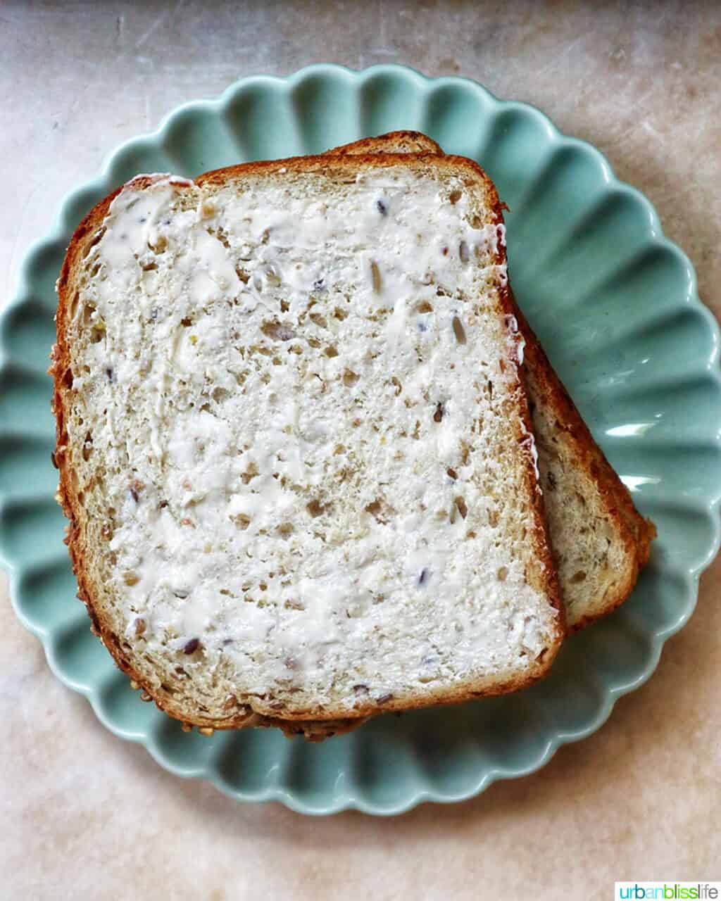 buttered bread slices on a plate.