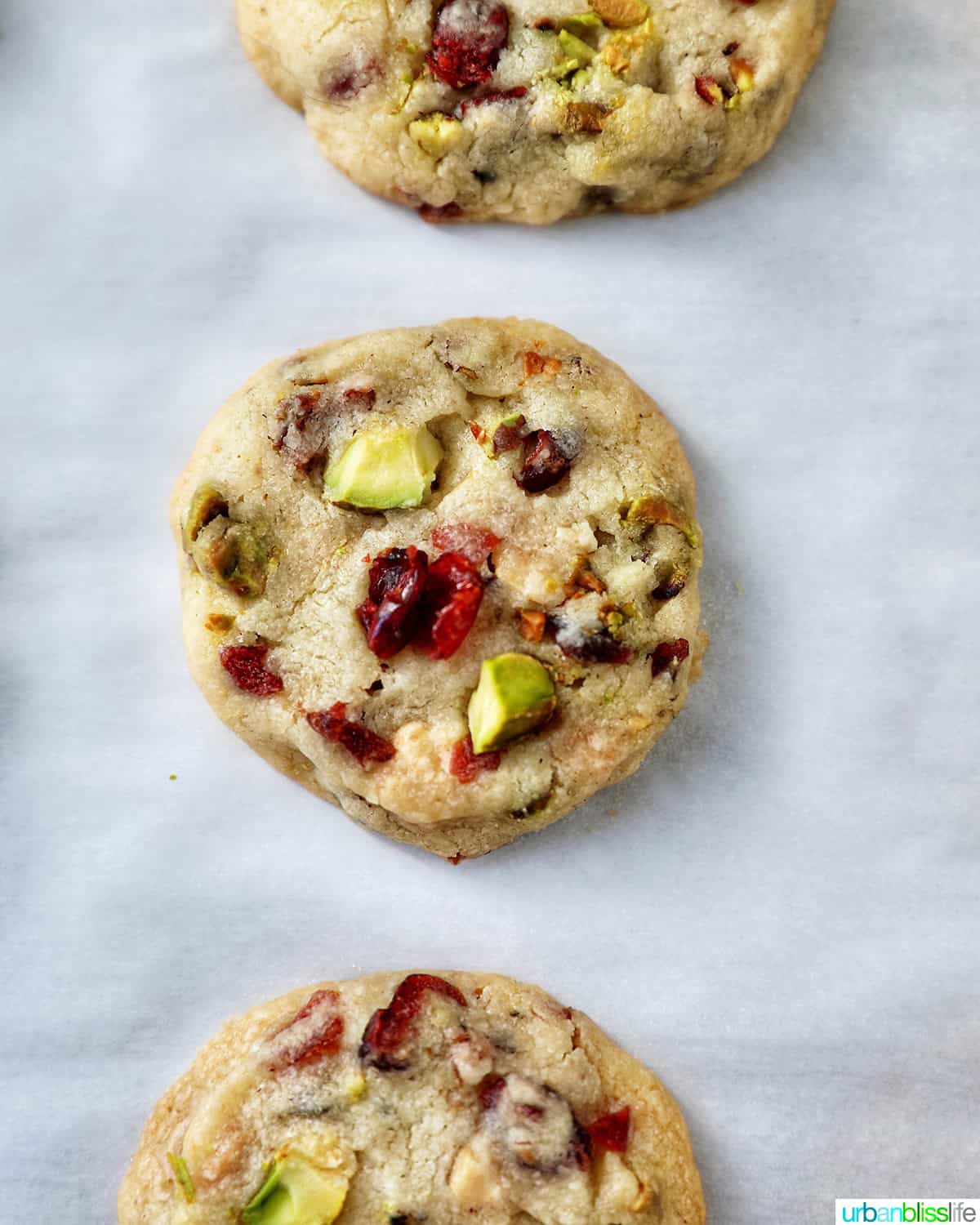 three pistachio cranberry shortbread cookies.