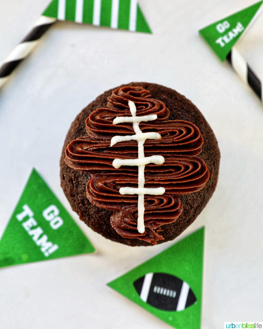 white lines added to football cupcakes.