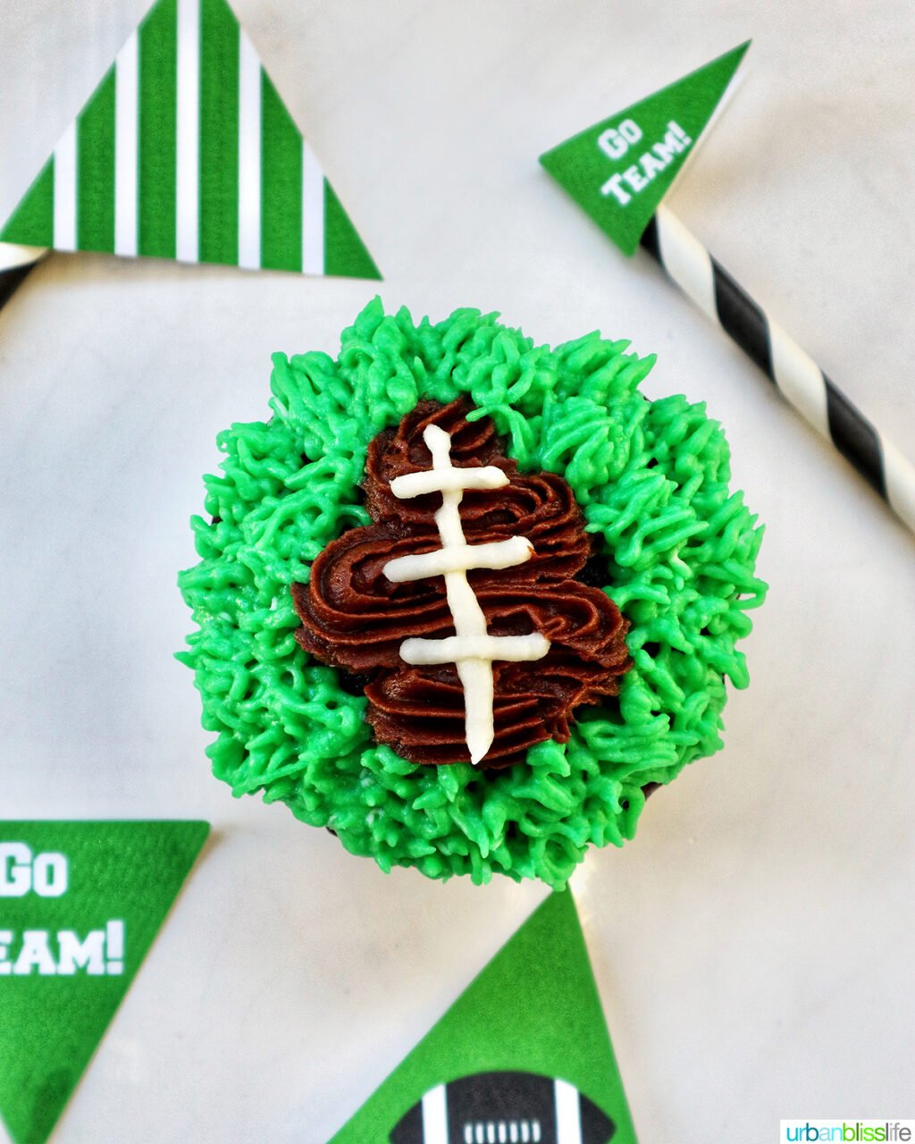 green frosting added to football cupcakes.