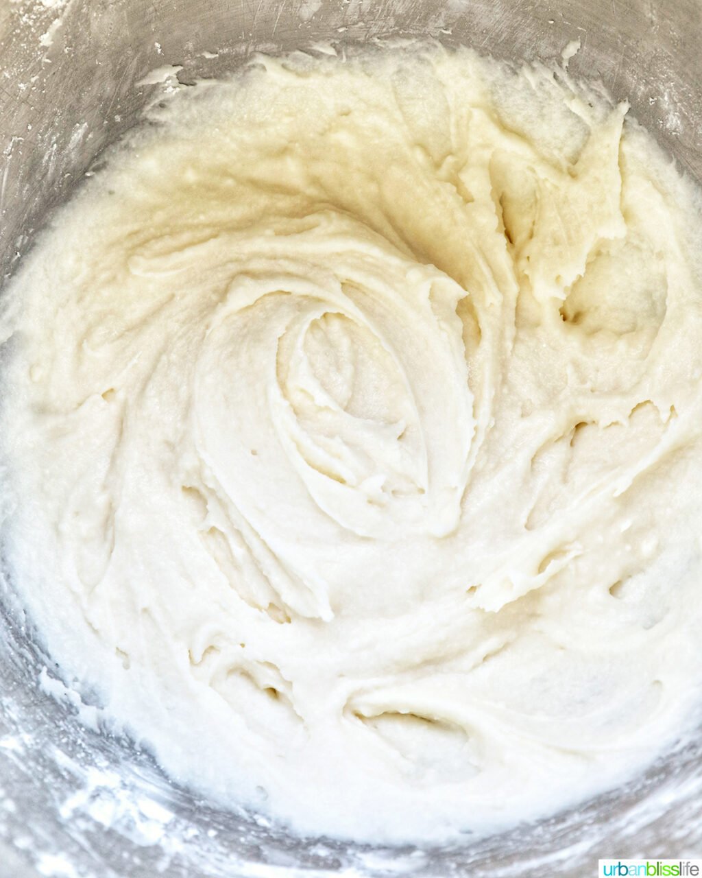 ingredients to make buttercream frosting in a stand mixing bowl.