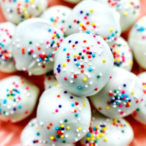 plate of colorful birthday cake truffles.