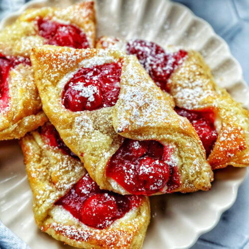 cherry danish pastries on a plate