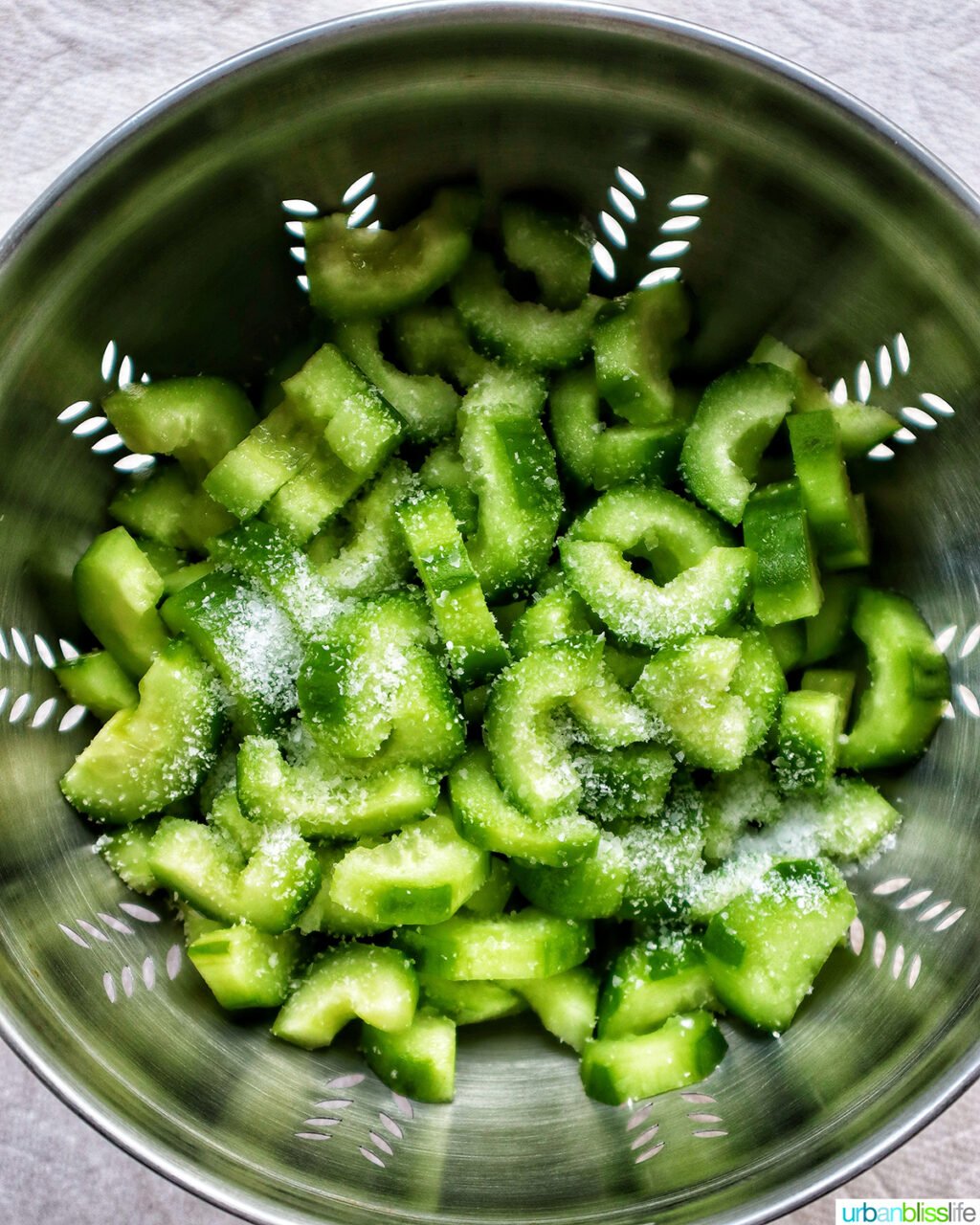 cucumbers and salt in colander.