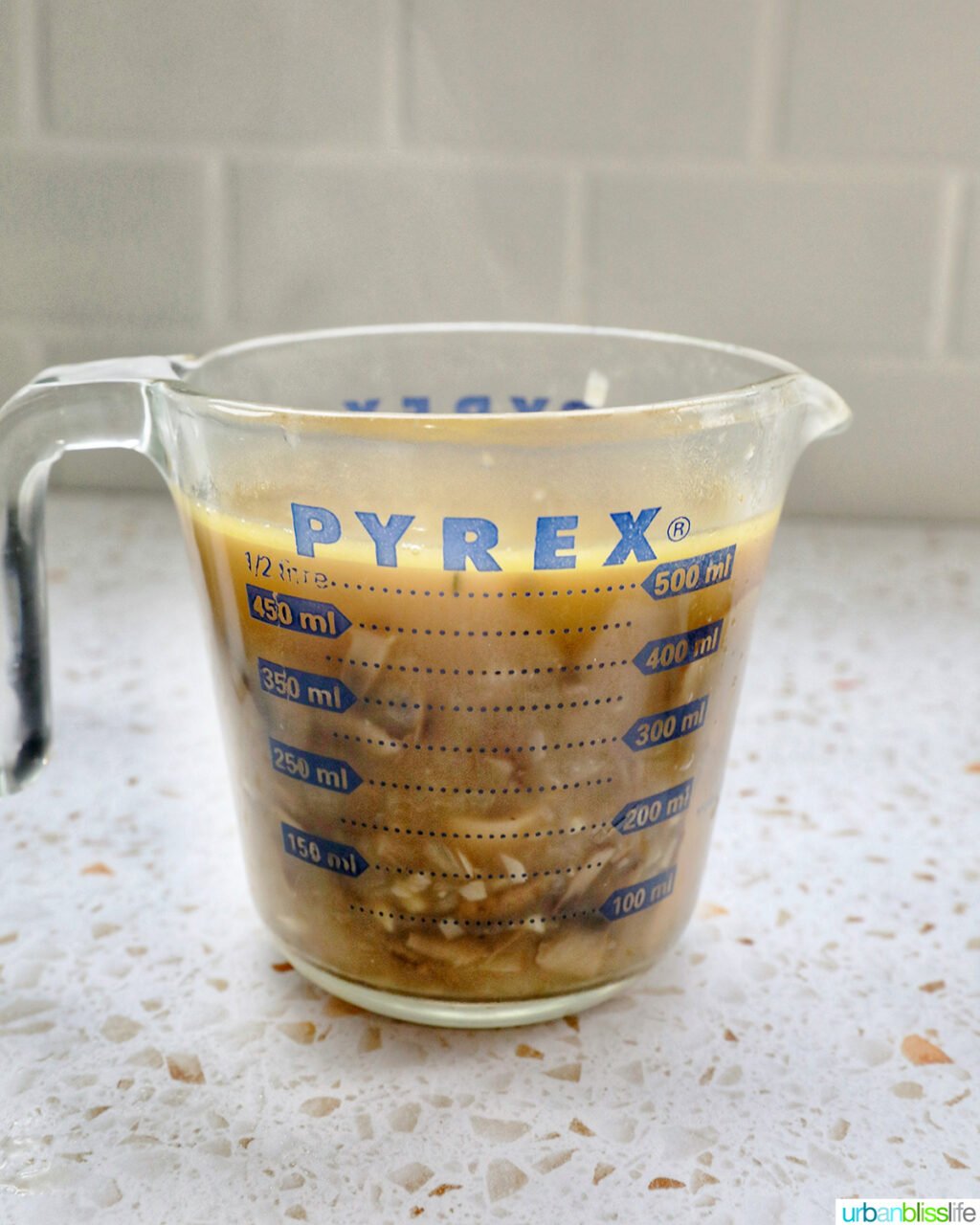 measuring cup with mushroom soup.