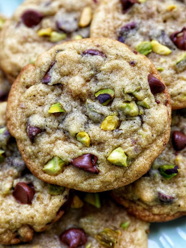 chocolate chip pistachio cookies on a plate.