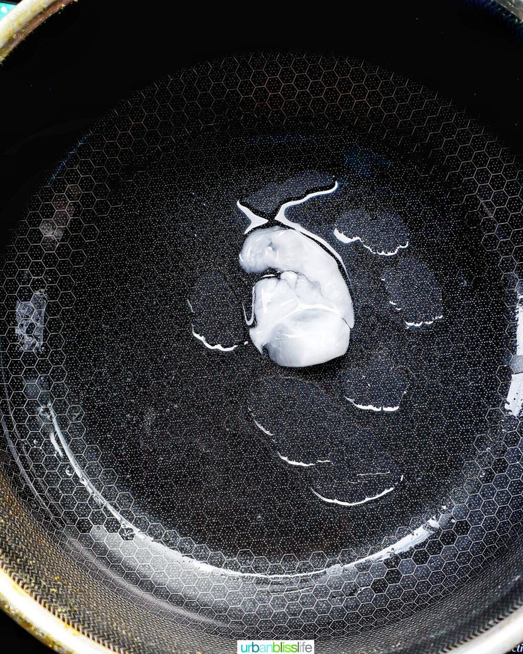 coconut oil melting in a pot.