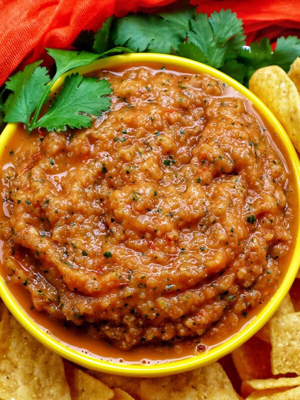 mango habanero salsa in a bowl with tortilla chips.