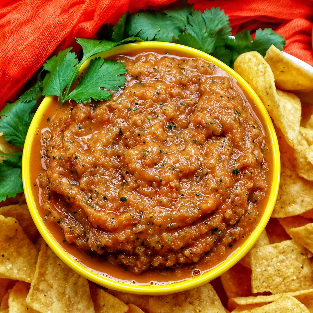 mango habanero salsa in a bowl with tortilla chips.