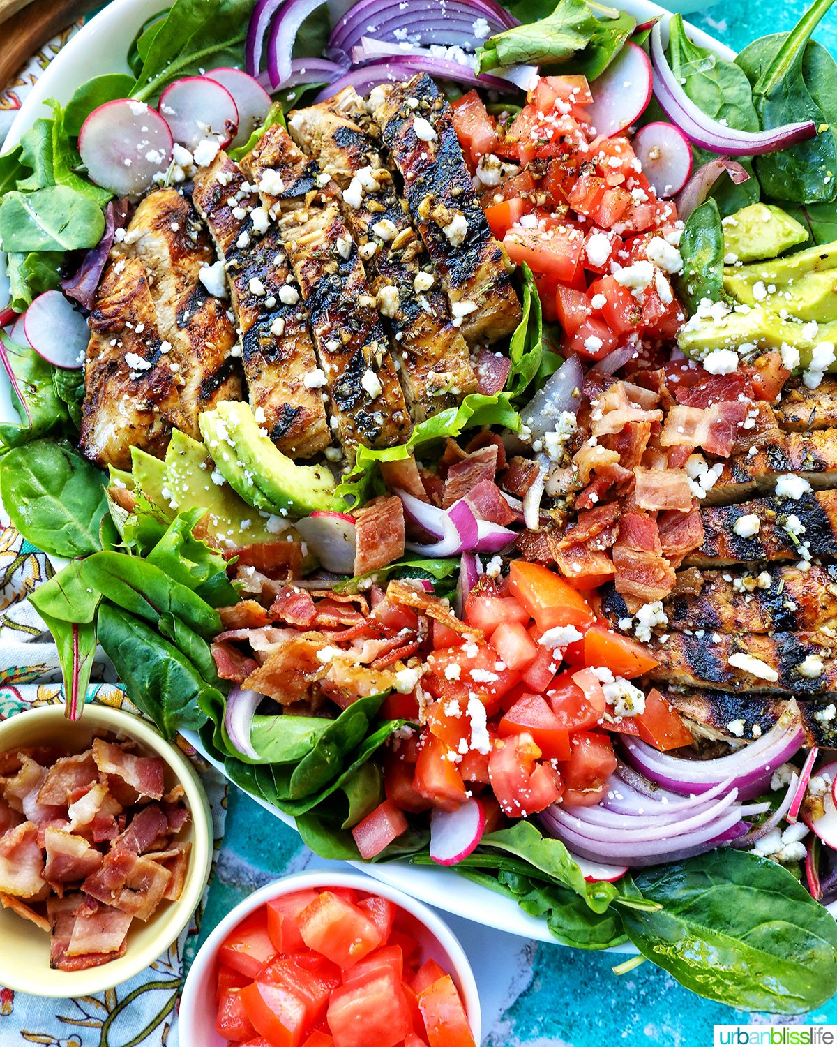Balsamic Chicken Salad with bowls of tomatoes and bacon.