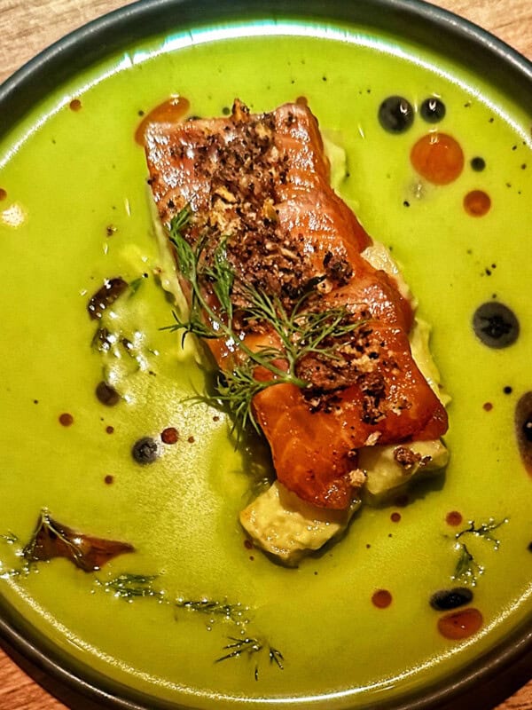 salmon in coconut cream spinach at Hav and Mar restaurant in New York City.