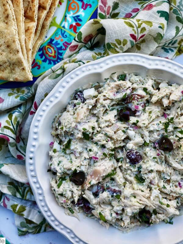 bowl of chicken tzatziki salad with side of pita bread.