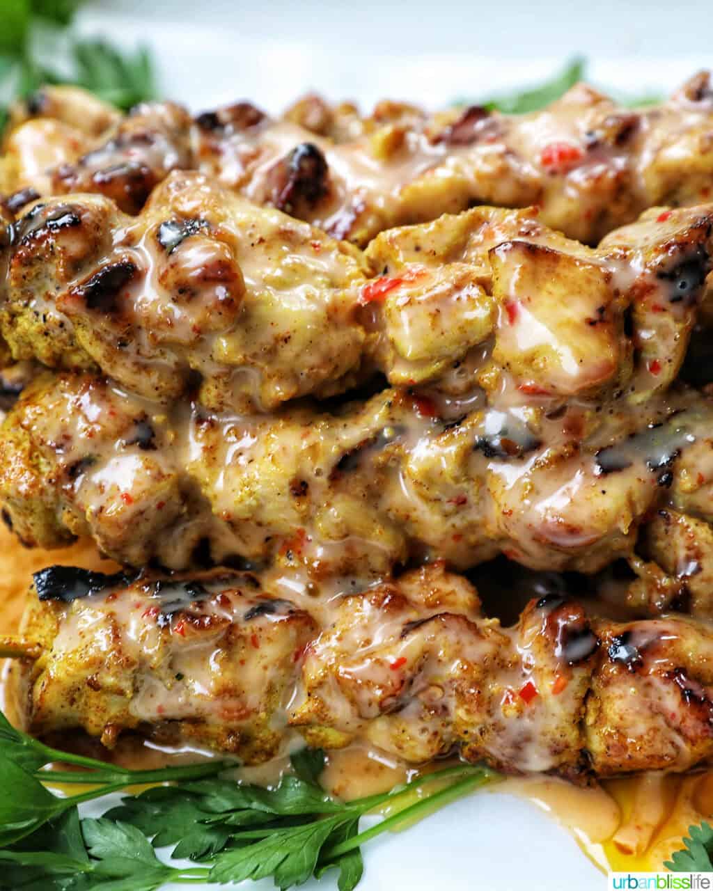 stack of bang bang chicken skewers.