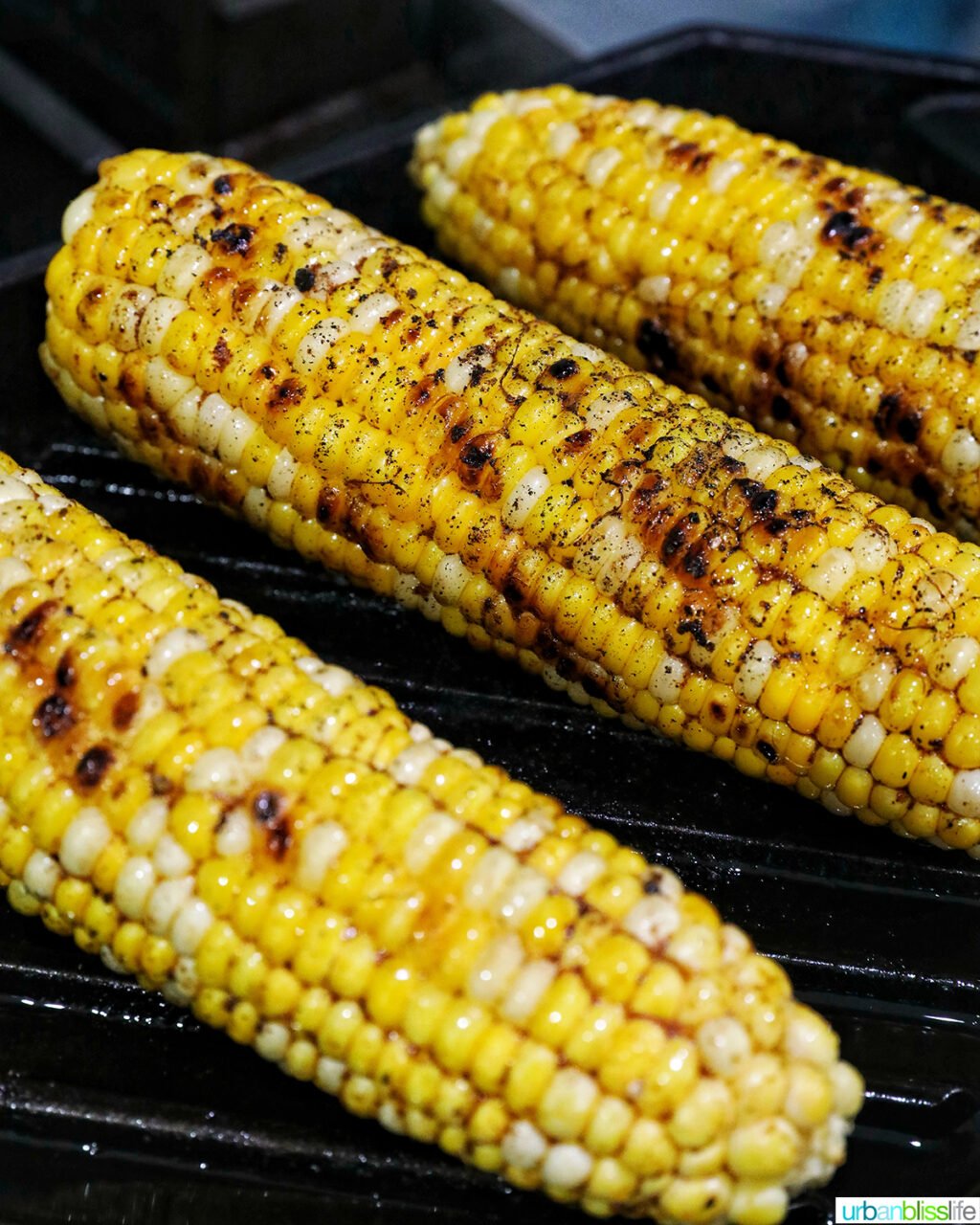corn on the cob on a grill pan.