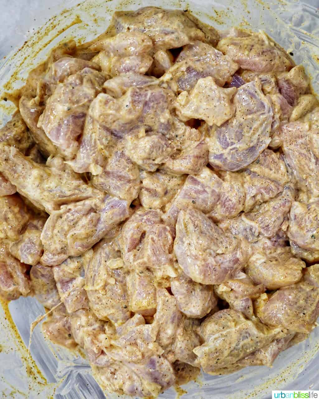 chicken marinating in tandoori marinade sauce.