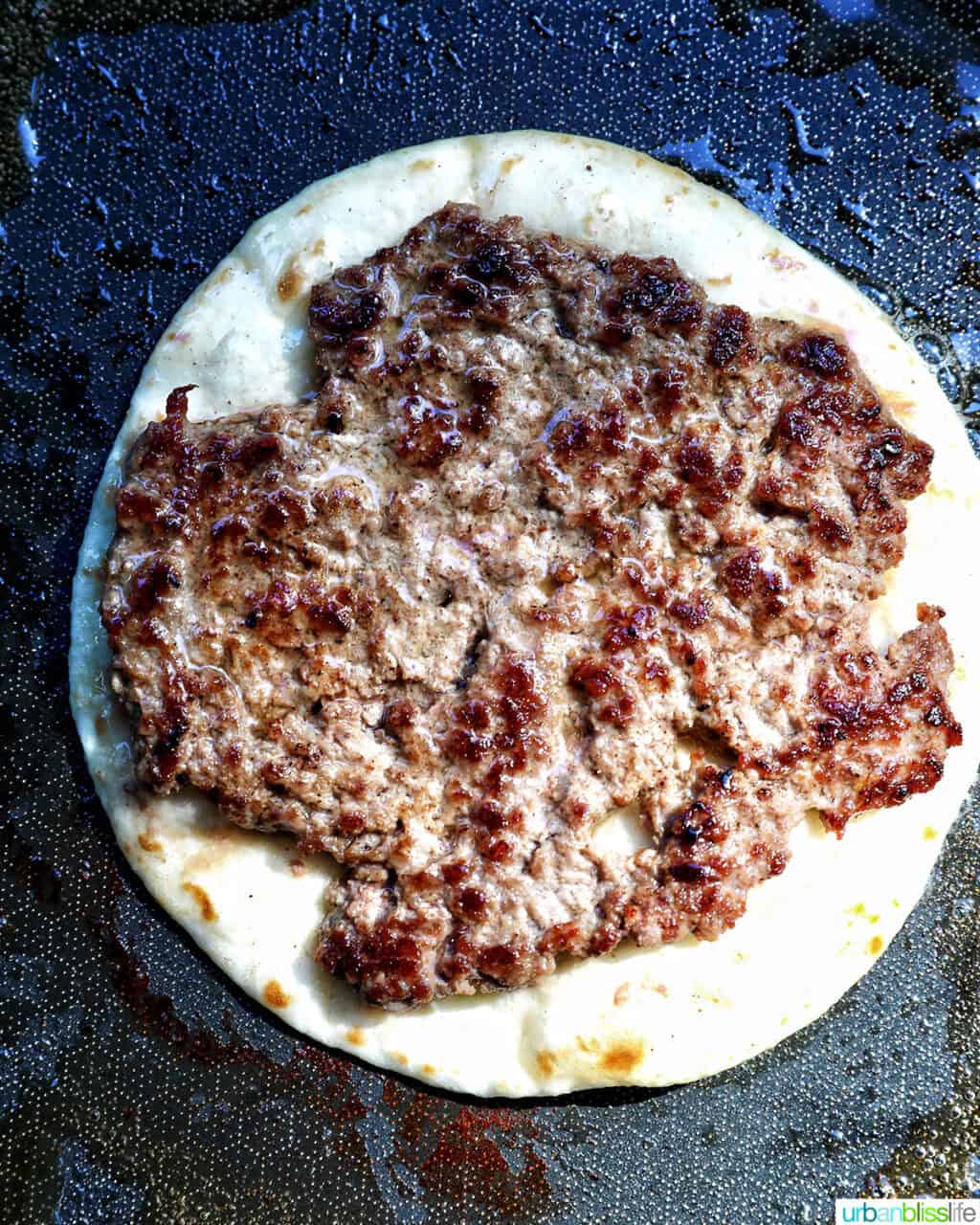 smash burger on a taco tortilla.