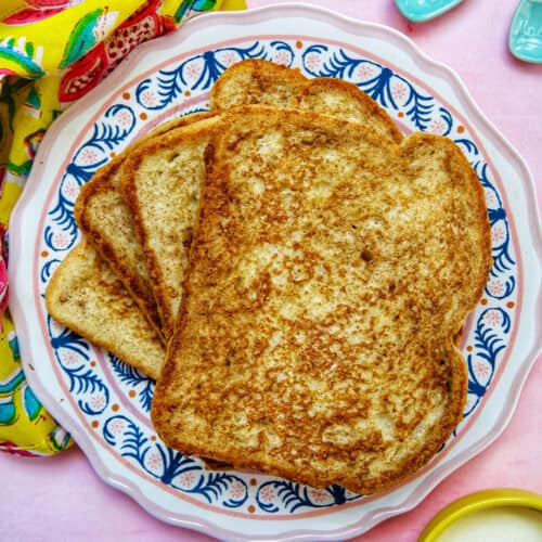 stack of high protein french toast on a colorful plate.