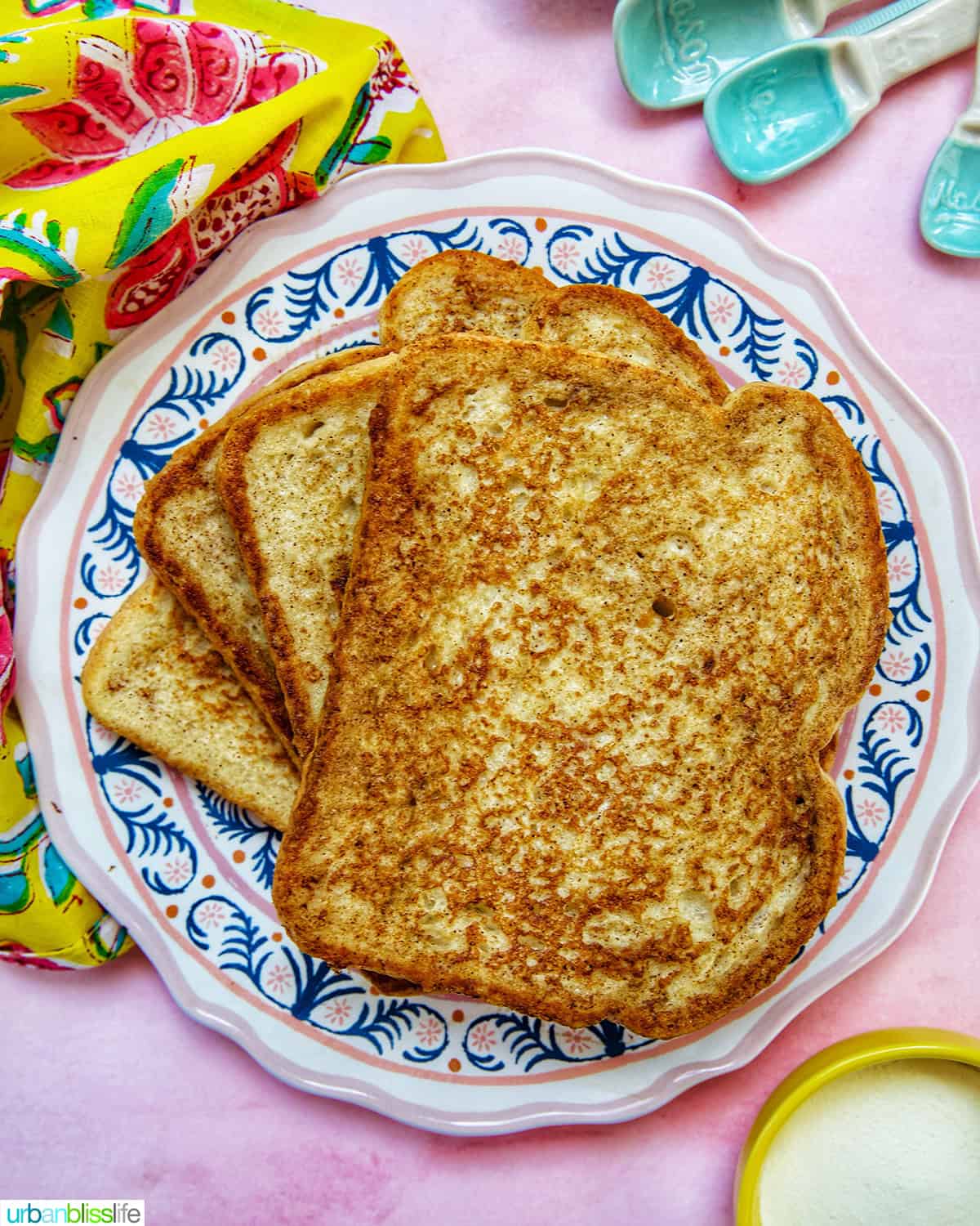 stack of high protein french toast on a colorful plate.