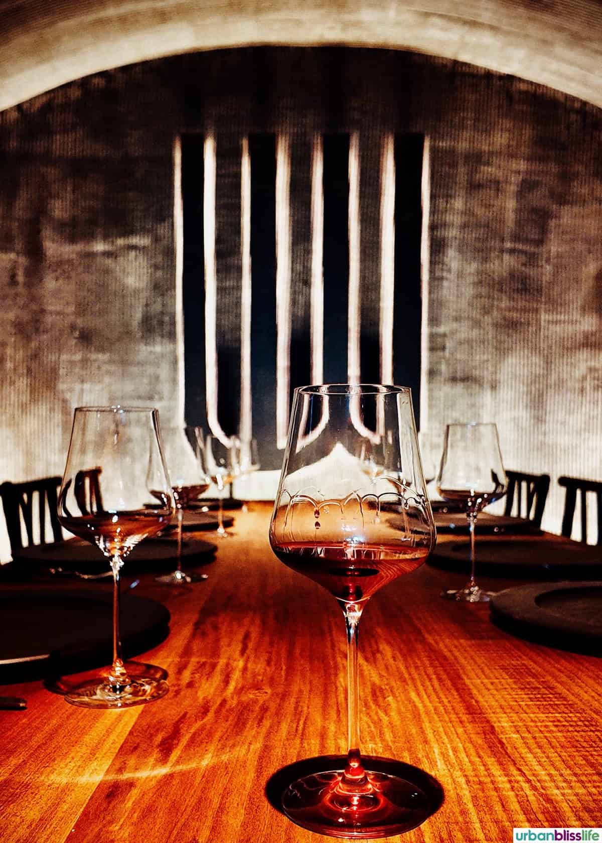 LucidWild cave with glass of red wine