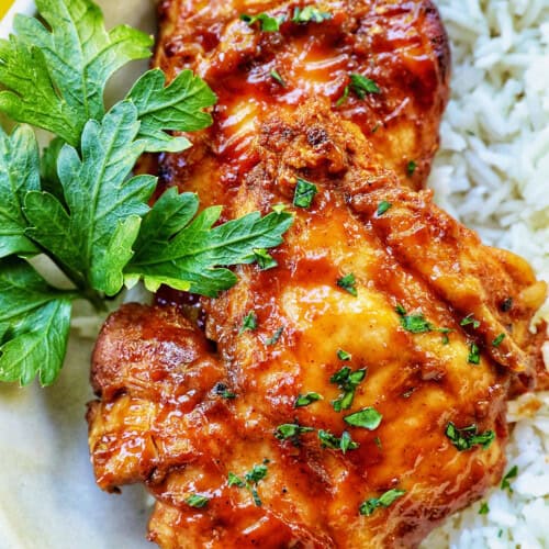 Slow Cooker Barbecue Chicken Thighs with white rice.