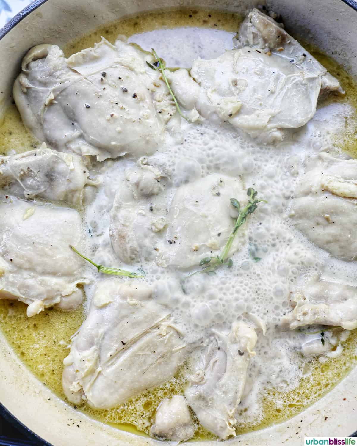 chicken cooking in a pan.
