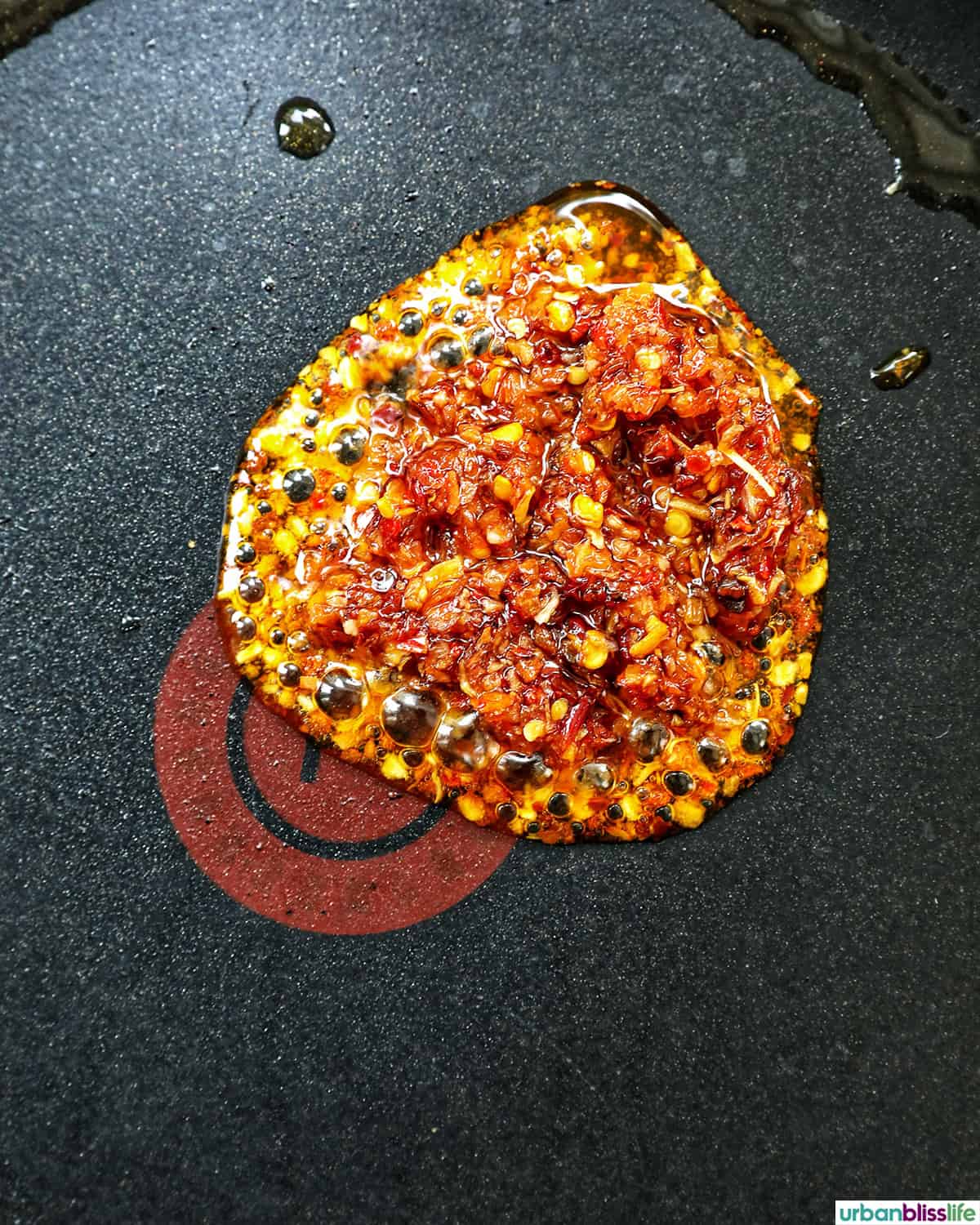 chili crisp and oil in a pan.