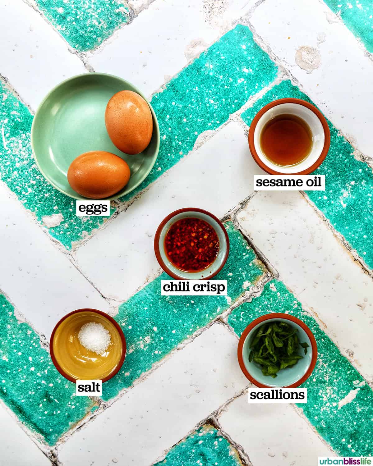bowls of ingredients to make chili crisp eggs.