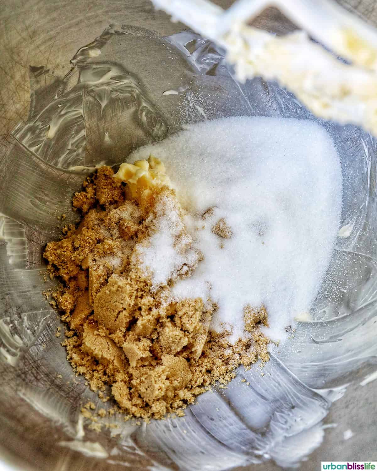 sugars and butter in a stainless steel mixing bowl.