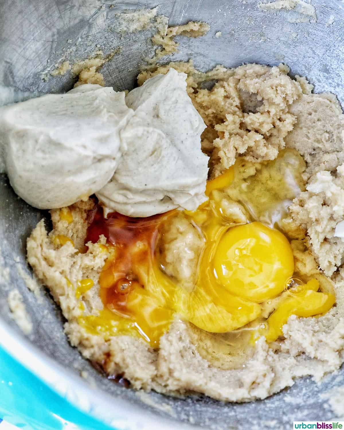 cookie batter in a stainless steel mixing bowl.
