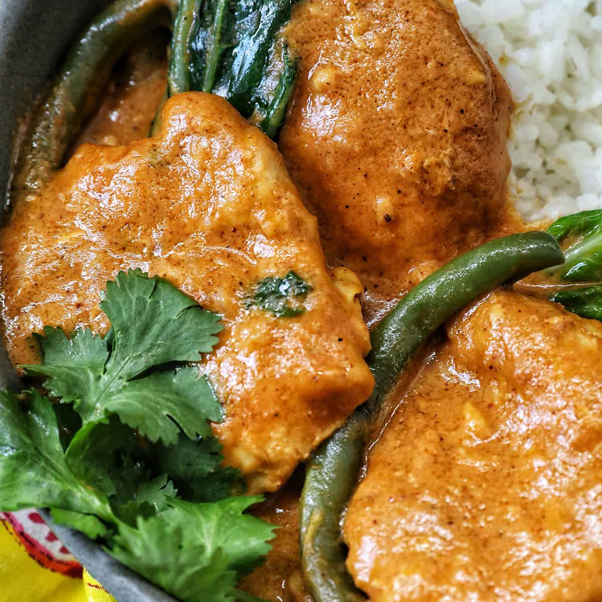 bowl of Filipino chicken kare kare.
