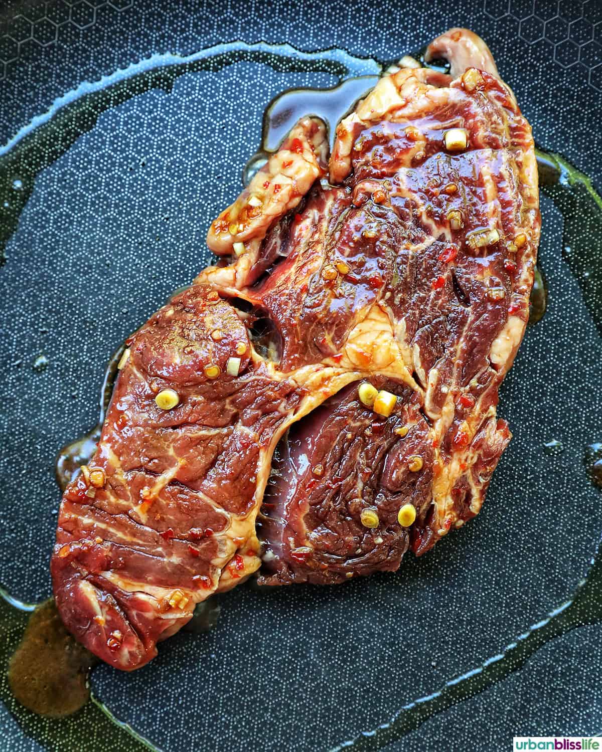 steak cooking on a skillet.