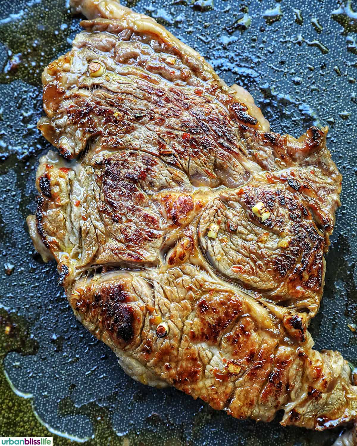 steak cooked on a skillet.
