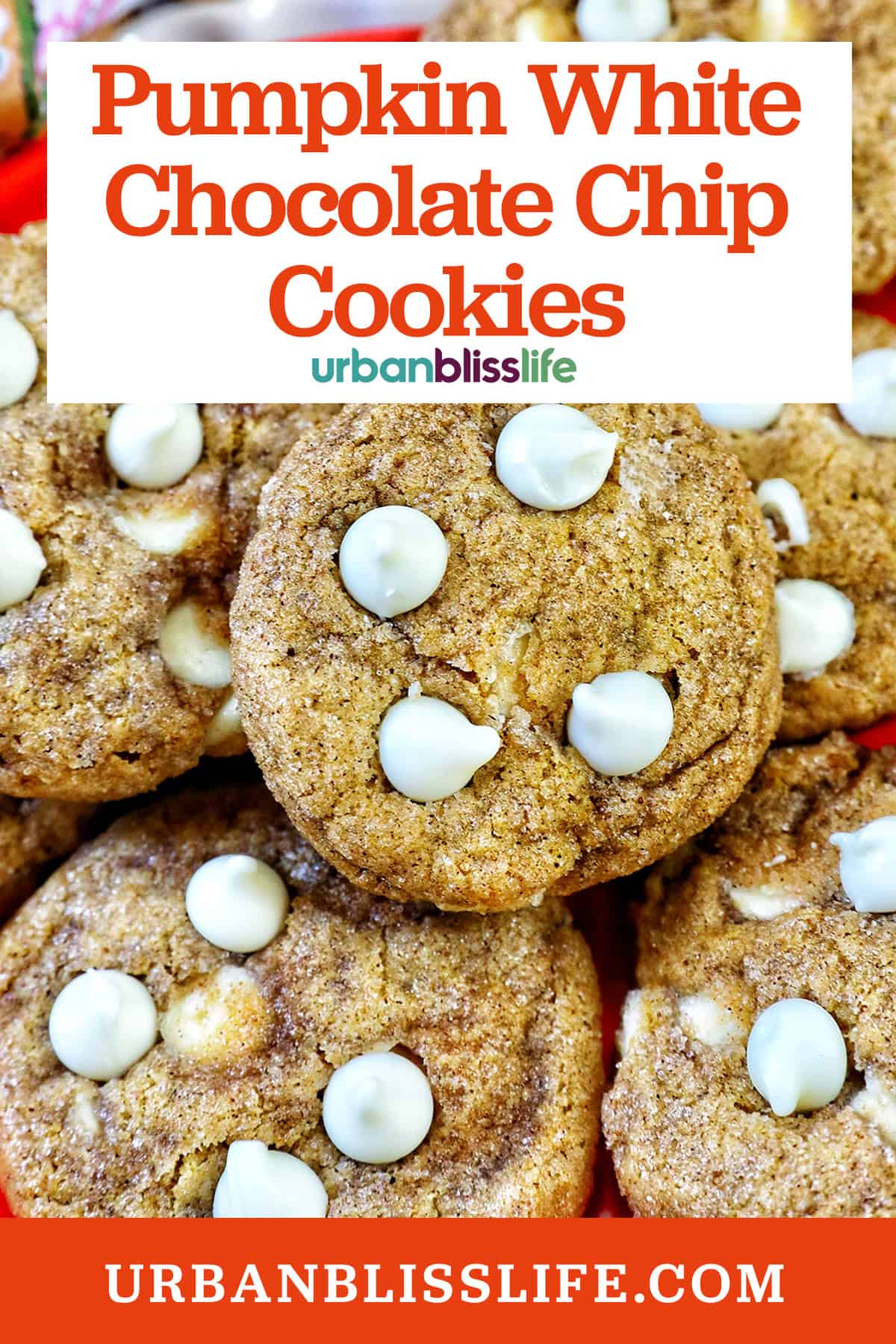 stack of pumpkin white chocolate chip cookies on an orange plate with title text overlay.